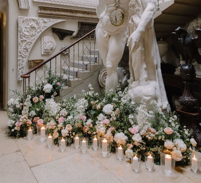 Statue at Aynhoe Park decorated with romantic flowers and candles