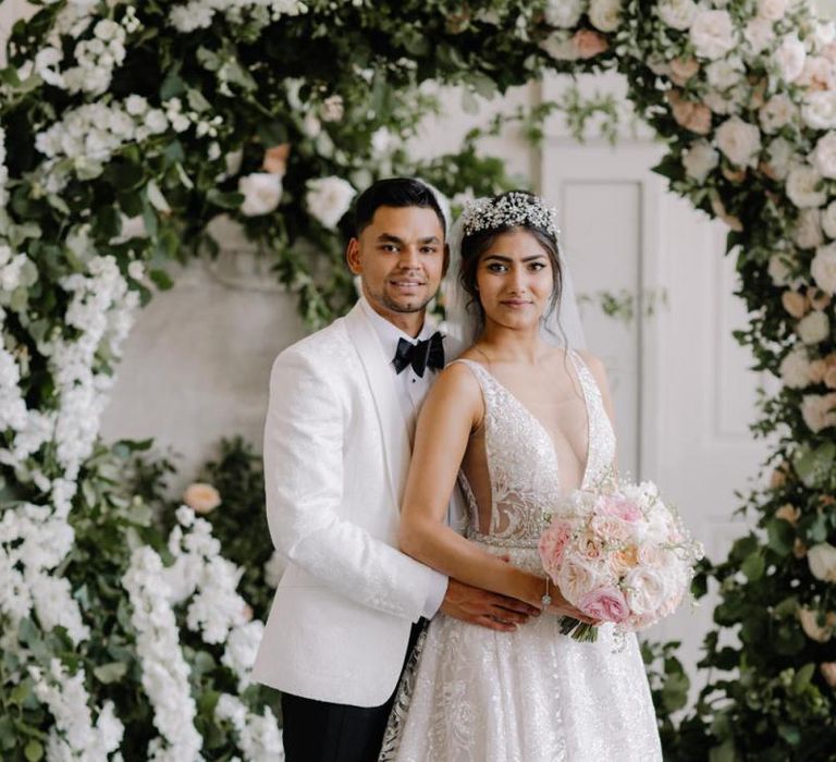 Bride and groom portrait at Aynhoe Park with bride in Berta Bridal wedding dress