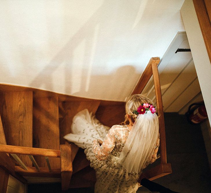 Bride in Bead Embellished Needle &amp; Thread Gown with Cascading Tulle Skirt and Semi-Sheer Sleeves | Elbow Length Veil | Bridal Up Do with Pink Hair Flowers | Mariachi Band and Persian Rug Aisle for Autumn Wedding | Leah Lombardi Weddings