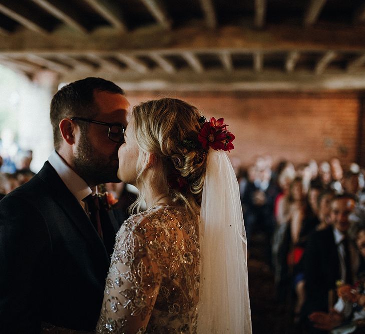 Bride in Bead Embellished Needle &amp; Thread Gown with Cascading Tulle Skirt and Semi-Sheer Sleeves | Elbow Length Veil | Bridal Up Do with Pink Hair Flowers | Groom in Check Blue Three-Piece Suit by T.M.Lewin with Maroon Tie and Pocket Square | Wedding Ceremony at Pimhill Barn | Mariachi Band and Persian Rug Aisle for Autumn Wedding | Leah Lombardi Weddings