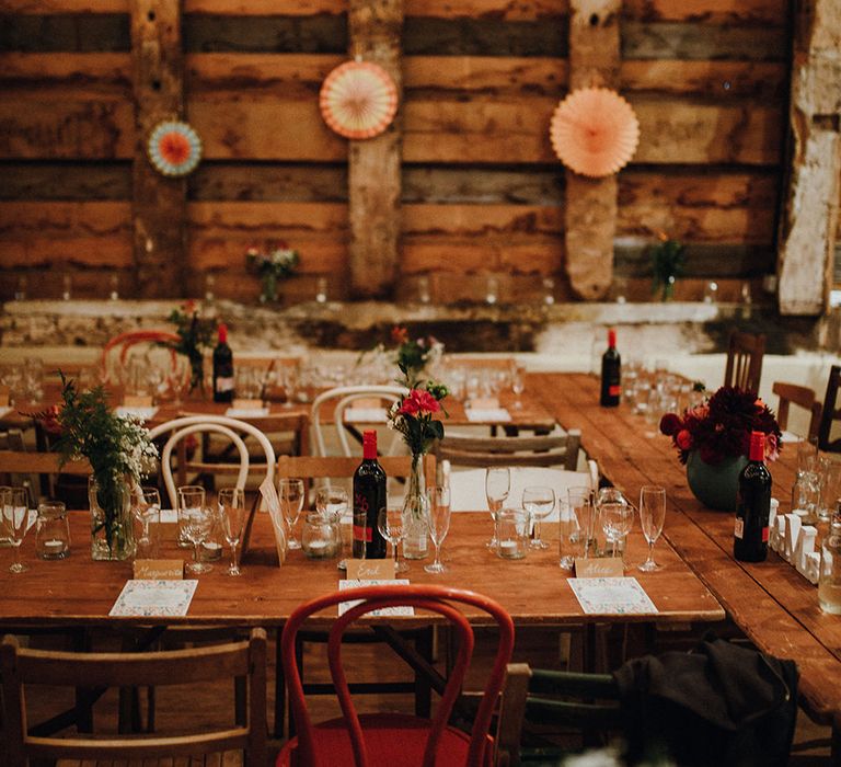 Wooden Banquet Tables | Mismatched Rustic Chairs | Paper Fans | Kraft Place Settings | Pink, Orange and Maroon Flowers for Tables | Mariachi Band and Persian Rug Aisle for Autumn Wedding | Leah Lombardi Weddings