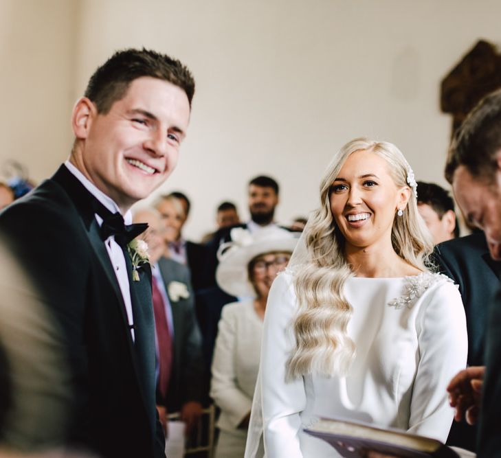 Bride and groom tie the knot at black tie autumn celebration in Wales