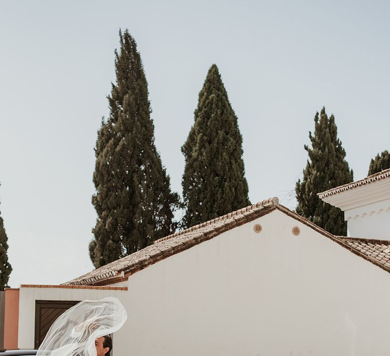 Bride in Sole Alonso Feather Trim Wedding Dress | Malaga Destination Wedding | Sara Lobla Photography | Un Par de Medias Film