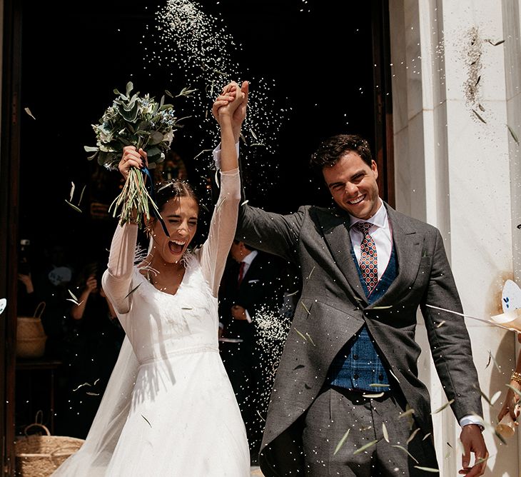 Confetti Moment | Bride in Sole Alonso Feather Trim Wedding Dress | Groom in Morning Suit | Malaga Destination Wedding | Sara Lobla Photography | Un Par de Medias Film