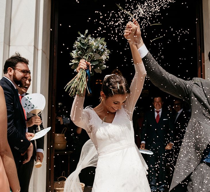 Confetti Exit | Bride in Sole Alonso Feather Trim Wedding Dress | Groom in Morning Suit | Malaga Destination Wedding | Sara Lobla Photography | Un Par de Medias Film