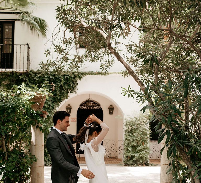 Bride in Sole Alonso Feather Trim Wedding Dress | Groom in Morning Suit | Malaga Destination Wedding | Sara Lobla Photography | Un Par de Medias Film