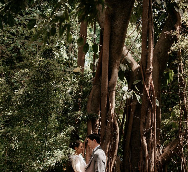 Bride in Sole Alonso Feather Trim Wedding Dress | Groom in Morning Suit | Malaga Destination Wedding | Sara Lobla Photography | Un Par de Medias Film