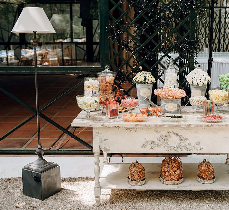 Sweets Table in Apothecary Jars | Malaga Destination Wedding | Sara Lobla Photography | Un Par de Medias Film