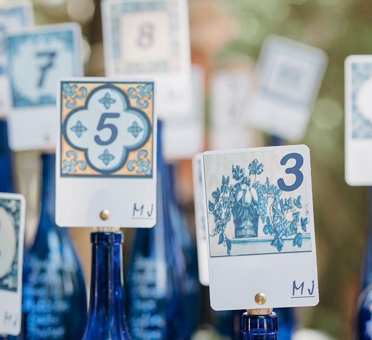 Blue Table Plan Signs On The Day Wedding Stationery Reception Decor | Malaga Destination Wedding | Sara Lobla Photography | Un Par de Medias Film