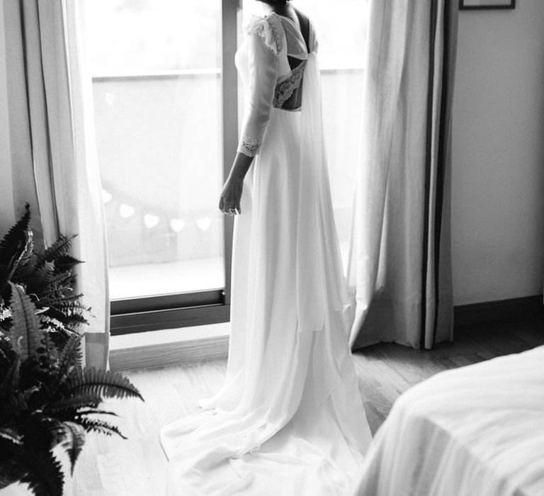 Stylish Wedding Dress with beautiful Back Detail from Beba’s Closet, for a Destination Wedding at Castillo de Viñuelas in Madrid, Spain | Lorena San José Photography