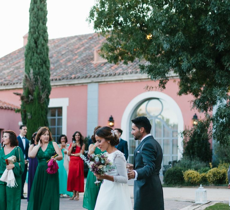 Stylish Wedding Dress with beautiful Back Detail from Beba’s Closet, for a Destination Wedding at Castillo de Viñuelas in Madrid, Spain | Lorena San José Photography