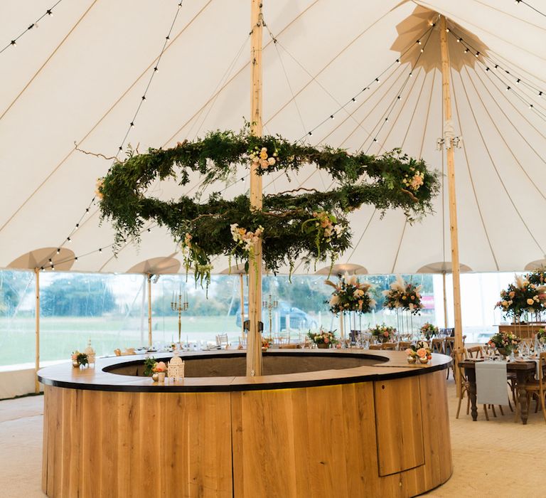 Foliage Hoop in Tent Wedding by PapKata Image by Lucy Davenport Photography