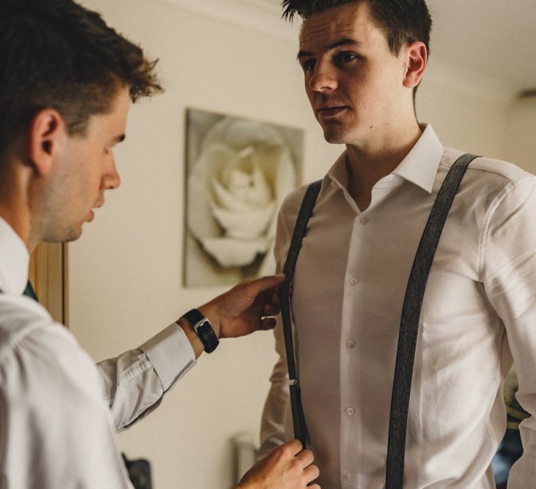 Groom on wedding morning in braces