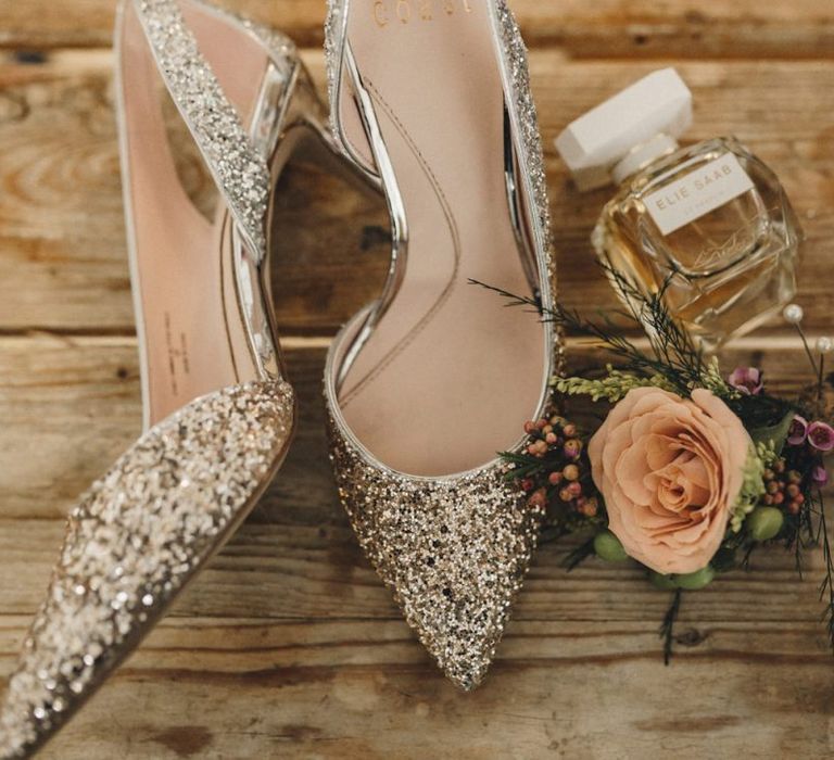 Silver glitter wedding shoes and perfume