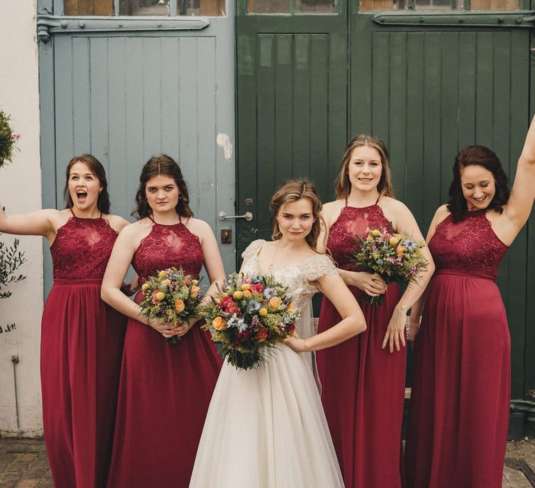 Bridal party portrait with bridesmaids in red lips dresses