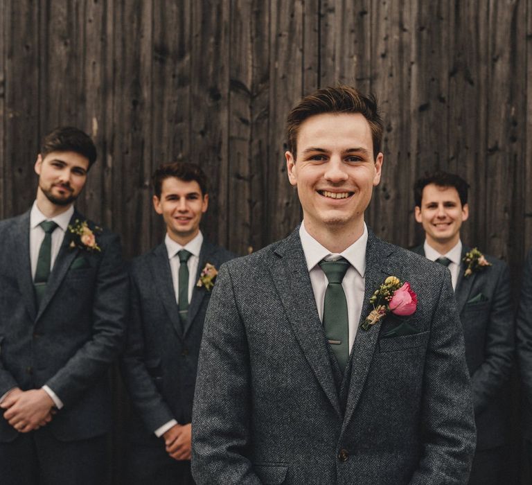 groomsmen in blue wool suits