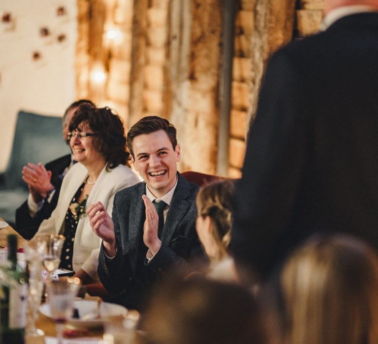 Groom laughing during the wedding speeches