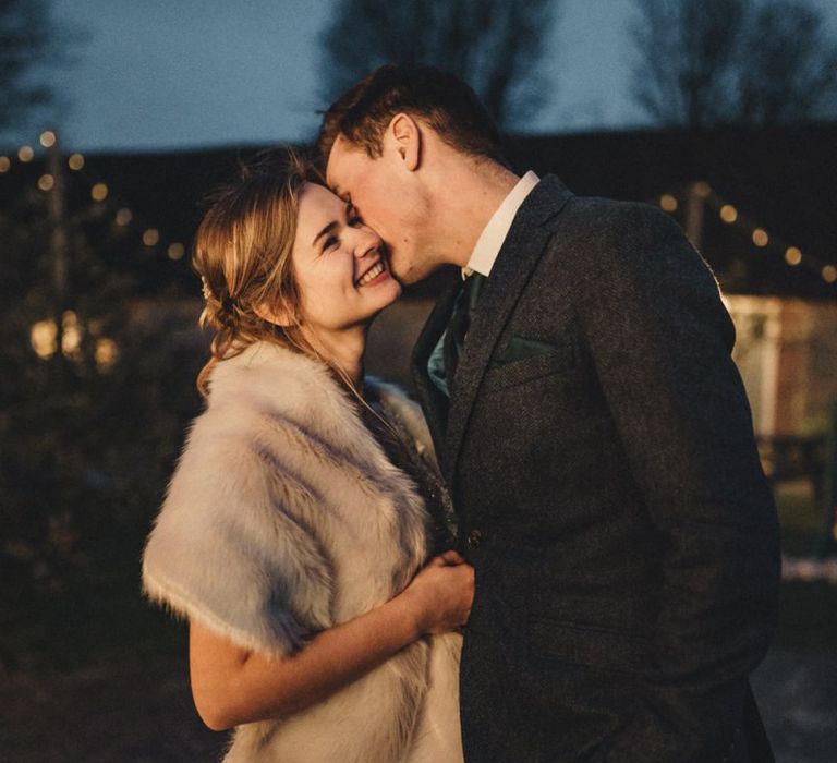 former 2014 Great British Bake Off contestant Martha Collinson in faux fur coverup at her wedding