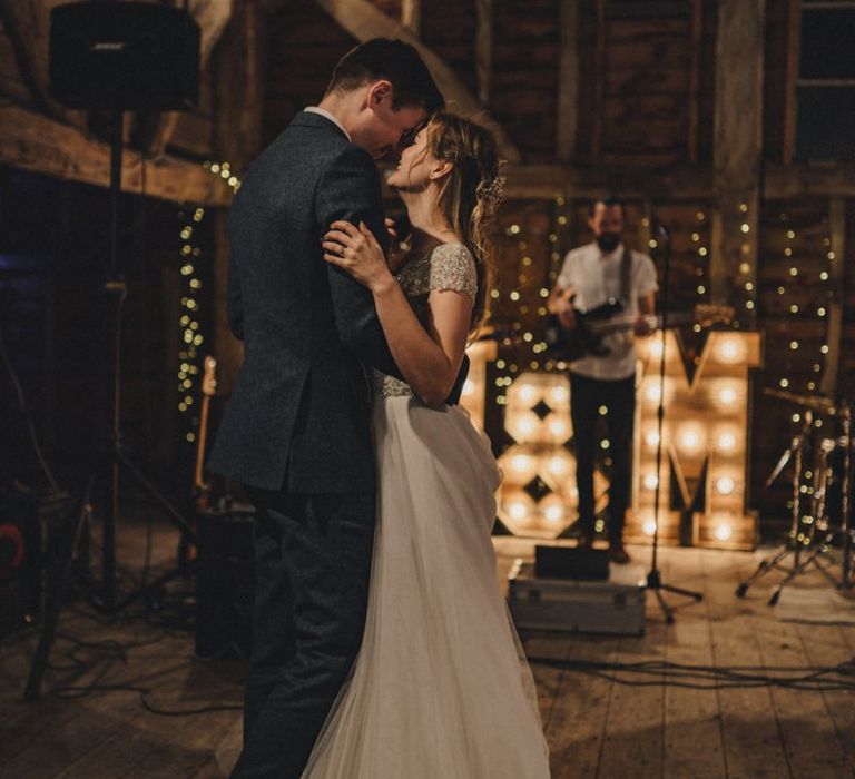 First dance with giant light up letters in the background