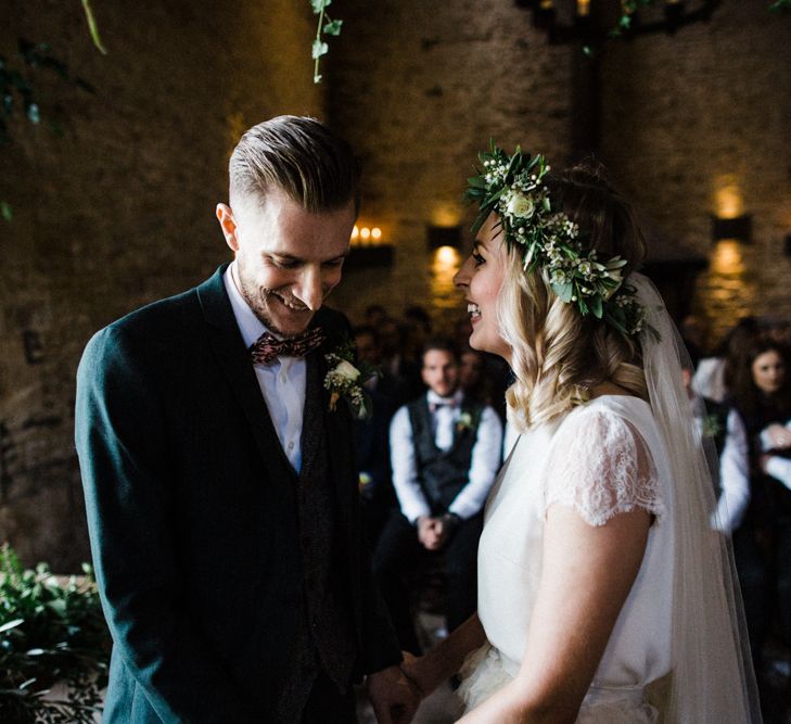 Wedding Ceremony at Stone Barn with Bride in Halfpenny London Swan Tulle Petal Skirt and Flower Crown and Groom in Wool Suit and Bow Tie