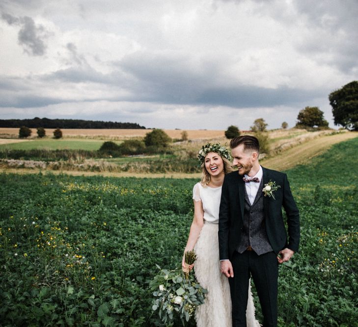 Bride in Halfpenny London Swan Tulle Petal Skirt and Flower Crown and Groom in Wool Suit &amp; Bow Tie