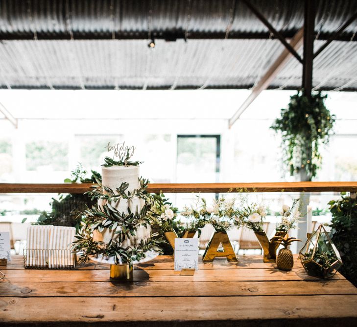 Dessert Table with Wedding Cake and Retro Sweets in Jars