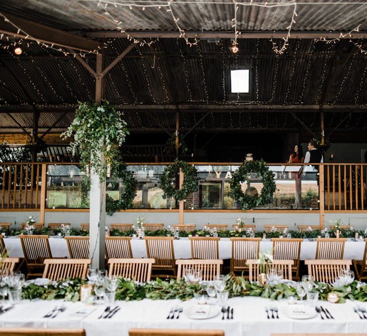 Green White and Gold Wedding Reception Decor at Cripps Stone Barn in Gloucestershire