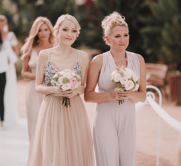 Bridesmaids in Different Blush Outfits | Blush Pink &amp; White Marbella Beach Wedding at El Chiringuito, Puente Romano |  Kino Ortega Photographer