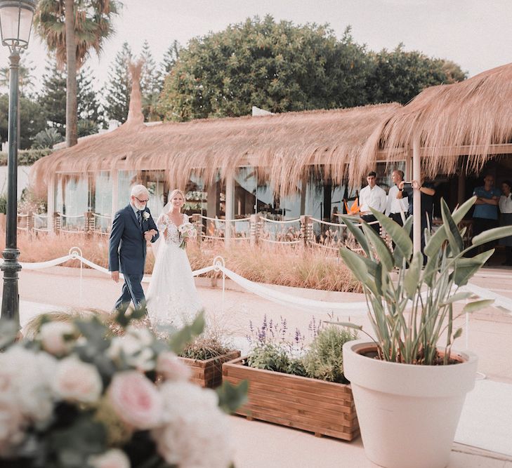 Wedding Ceremony | Bridal Entrance in Yaki Ravid Gown | Blush Pink &amp; White Marbella Beach Wedding at El Chiringuito, Puente Romano |  Kino Ortega Photographer