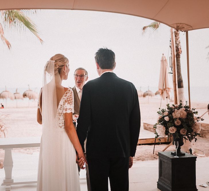 Wedding Ceremony | Bride in Yaki Ravid Gown | Groom in Armani Suit | Blush Pink &amp; White Marbella Beach Wedding at El Chiringuito, Puente Romano |  Kino Ortega Photographer