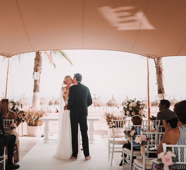 Wedding Ceremony | Bride in Yaki Ravid Gown | Groom in Armani Suit | Blush Pink &amp; White Marbella Beach Wedding at El Chiringuito, Puente Romano |  Kino Ortega Photographer