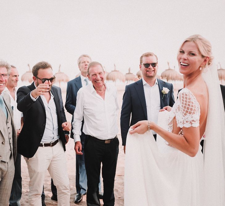 Bride in Embellished Bodice Yaki Ravid Gown | Blush Pink &amp; White Marbella Beach Wedding at El Chiringuito, Puente Romano |  Kino Ortega Photographer