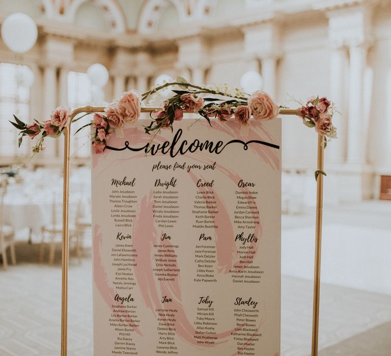 Metal Framed Table Plan For Wedding With Pink Flowers / Image By Nataly J Photography