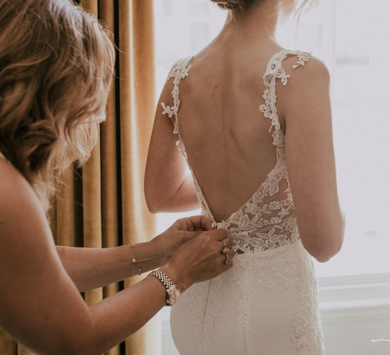 Bride In Low Backed Wedding Gown / Image By Nataly J Photography