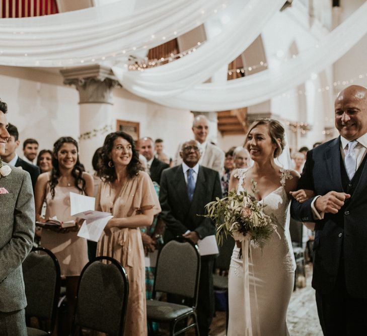 Wedding Ceremony With White Drapes For Decor / Image By Nataly J Photography