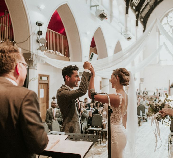 Wedding Ceremony With White Drapes For Decor / Image By Nataly J Photography