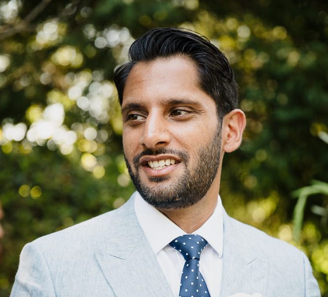 Groom in pale blue Reiss suit