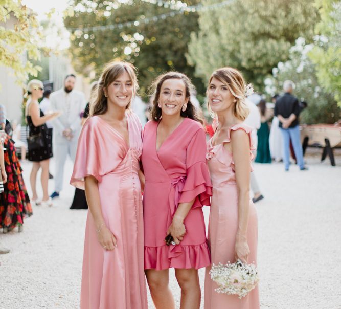 Bridesmaids in pink dresses made by the bride