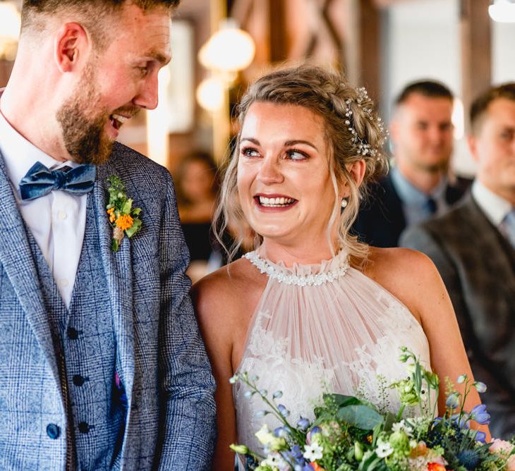 Wedding Ceremony | Bride in Halterneck Tulle Allure Bridal Wedding Dress | Groom in  Blue Check Moss Bros. Suit | Vintage Fairground at Blists Hill Victorian Town Museum in Ironbridge | Lisa Carpenter Photographer