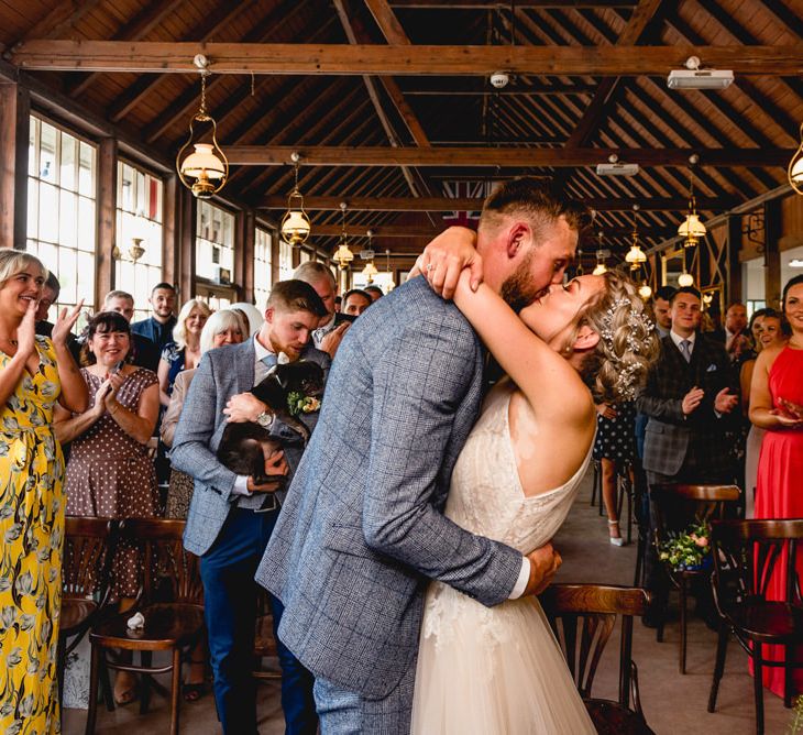 Wedding Ceremony | Bride in Halterneck Tulle Allure Bridal Wedding Dress | Groom in  Blue Check Moss Bros. Suit | Vintage Fairground at Blists Hill Victorian Town Museum in Ironbridge | Lisa Carpenter Photographer