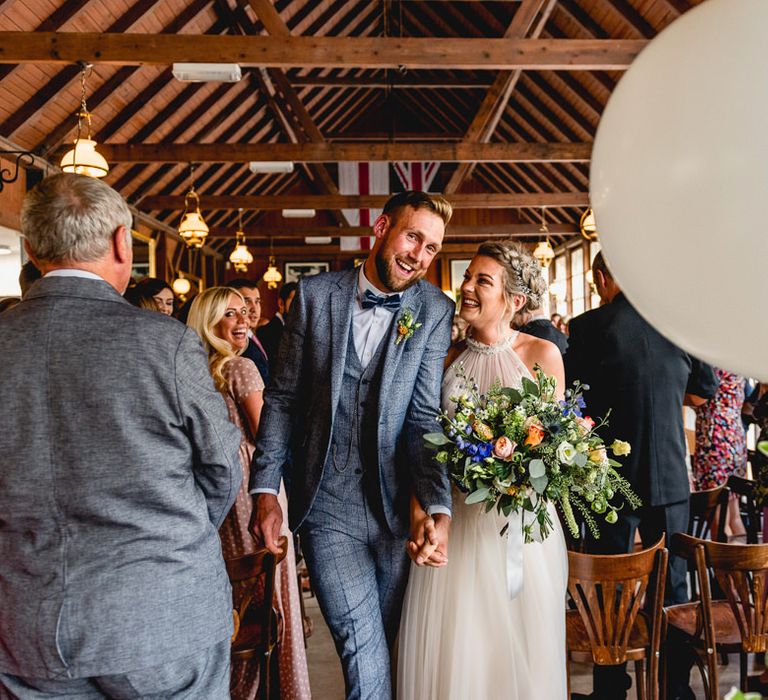 Wedding Ceremony | Bride in Halterneck Tulle Allure Bridal Wedding Dress | Groom in  Blue Check Moss Bros. Suit | Vintage Fairground at Blists Hill Victorian Town Museum in Ironbridge | Lisa Carpenter Photographer