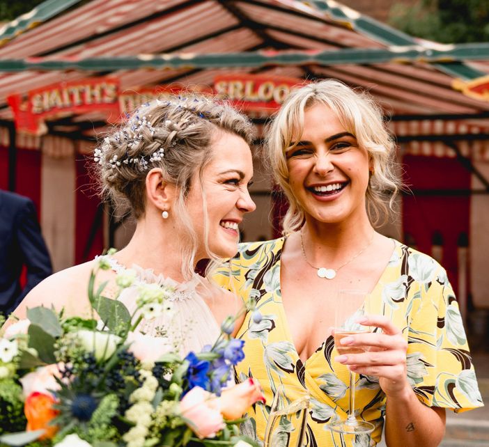 Bride in Halterneck Tulle Allure Bridal Wedding Dress | Wedding Guest in Floral Yellow Dress | Vintage Fairground at Blists Hill Victorian Town Museum in Ironbridge | Lisa Carpenter Photographer