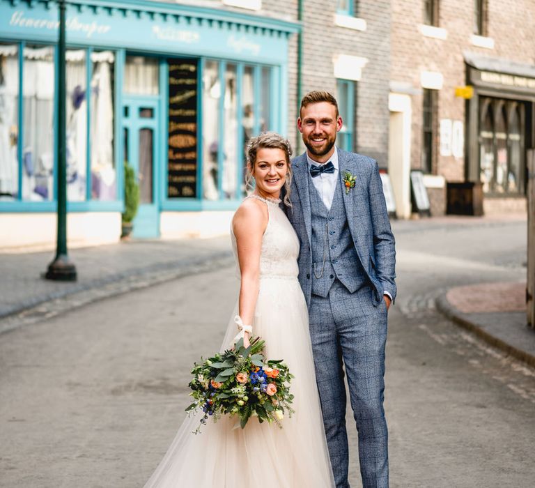 Bride in Halterneck Tulle Allure Bridal Wedding Dress | Groom in  Blue Check Moss Bros. Suit | Vintage Fairground at Blists Hill Victorian Town Museum in Ironbridge | Lisa Carpenter Photographer