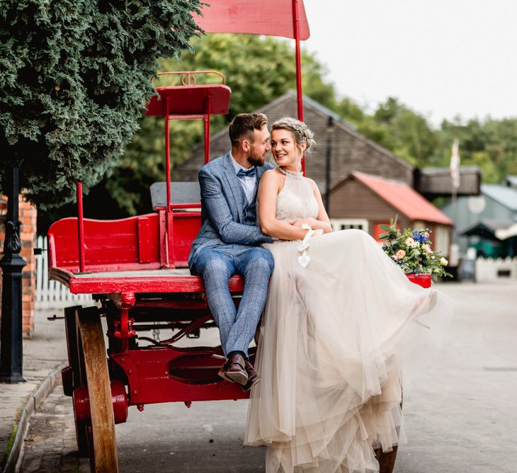 Bride in Halterneck Tulle Allure Bridal Wedding Dress | Groom in  Blue Check Moss Bros. Suit | Vintage Fairground at Blists Hill Victorian Town Museum in Ironbridge | Lisa Carpenter Photographer