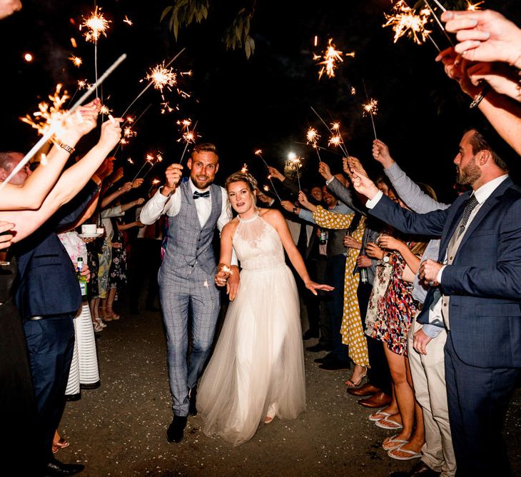 Sparkler Exit | Bride in Halterneck Tulle Allure Bridal Wedding Dress | Groom in  Blue Check Moss Bros. Suit | Vintage Fairground at Blists Hill Victorian Town Museum in Ironbridge | Lisa Carpenter Photographer