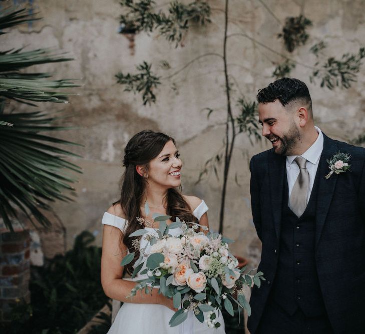 Bride and Groom Laughing Together