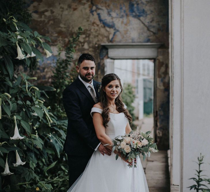 Bride and Groom Embracing