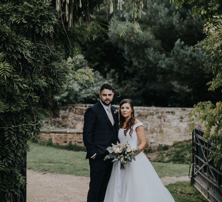 Bride and Groom Wedding Picture in Venue's Gardens