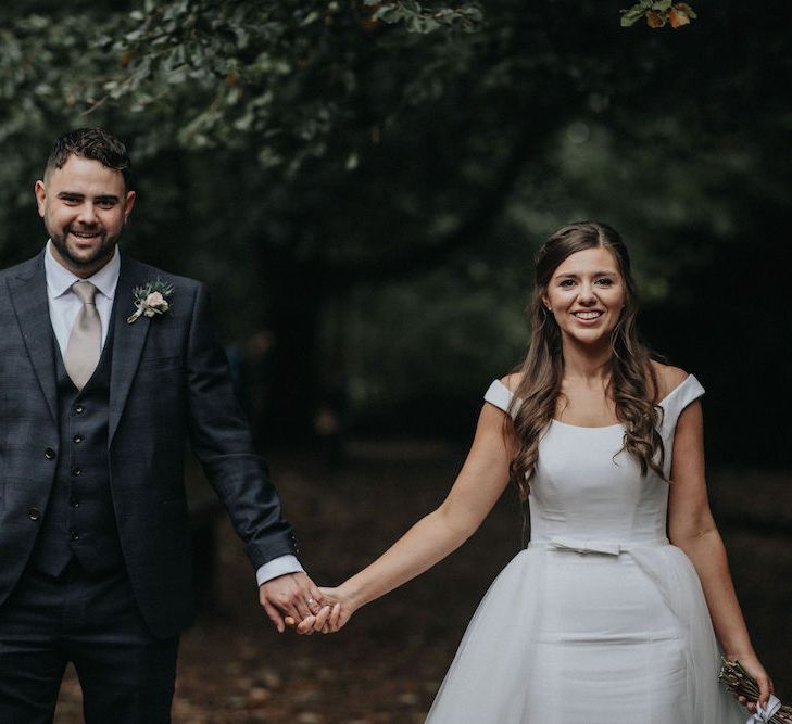 Bride and Groom Holding Hands Wedding Picture