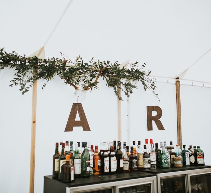 Wedding Bar // Woodland Luxe Wedding With Personalised Wooden Place Mats For Guests Marquee Wedding At Home With Images From Darina Stoda Photography